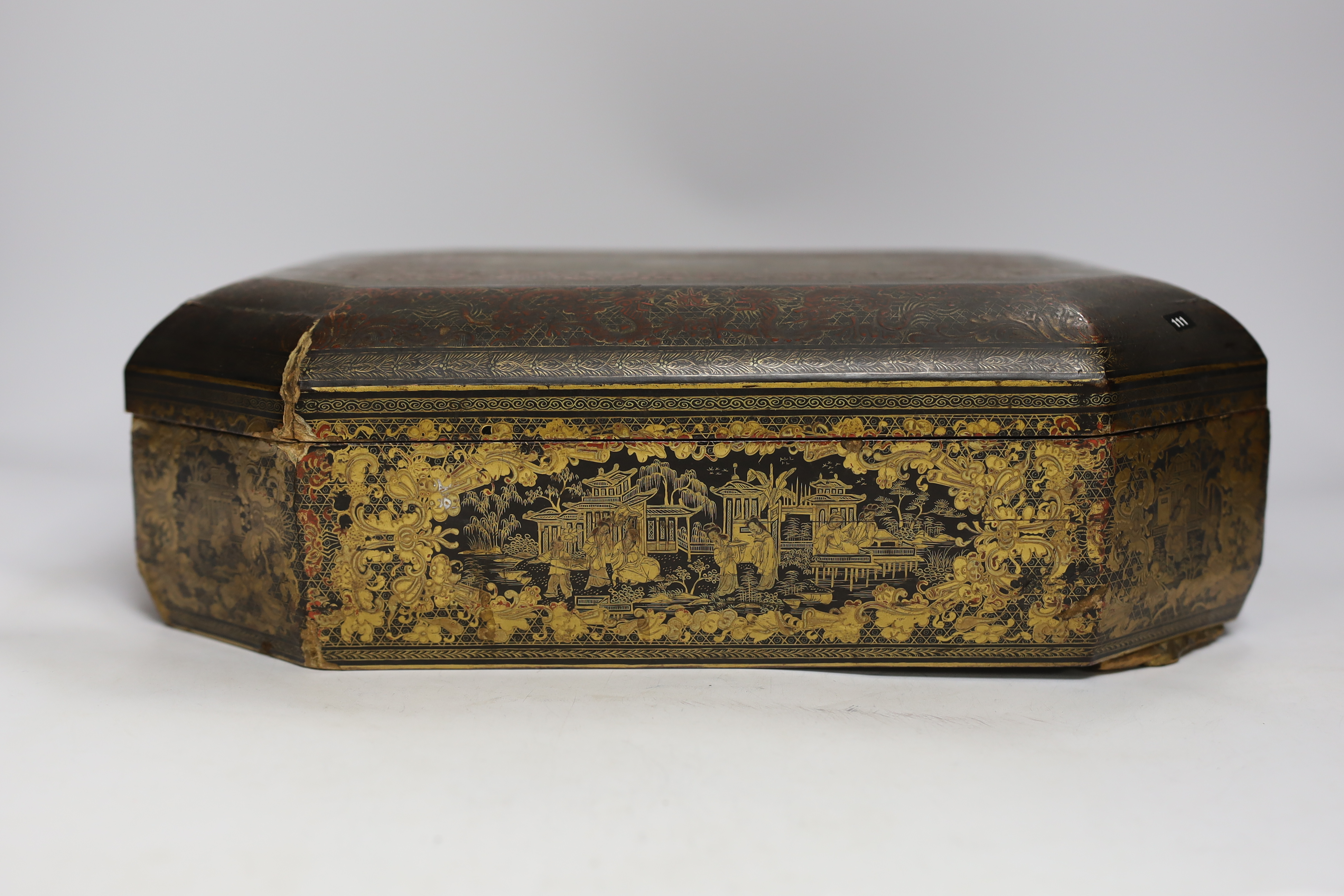 A mid 19th century Chinese gilt-decorated black lacquer games box containing mother-of-pearl counters